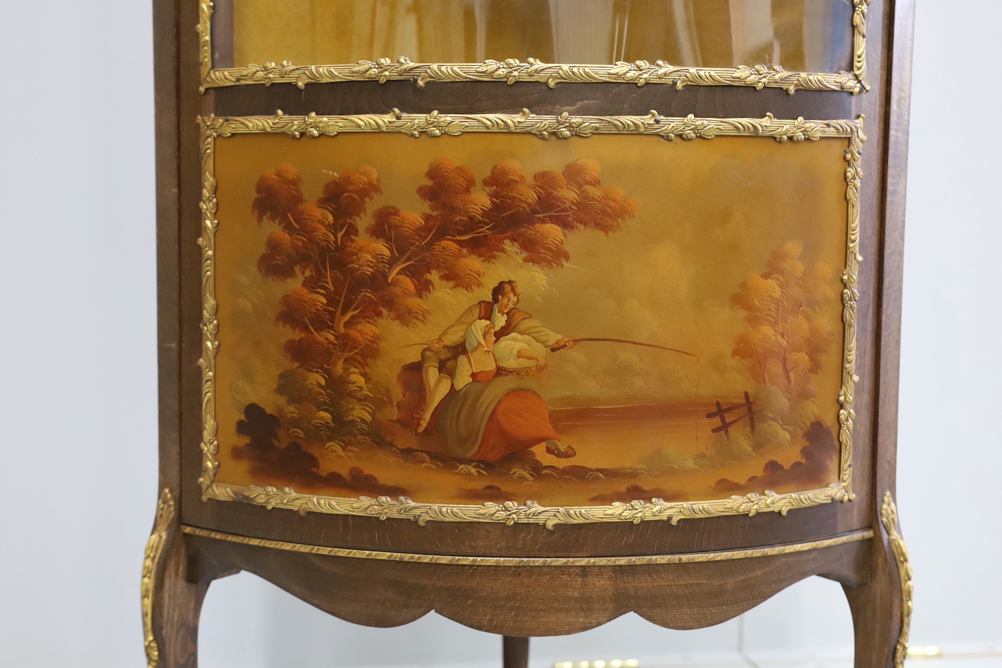 A Vernis Martin style gilt metal mounted beech corner vitrine, width 63cm, depth 44cm, height 152cm